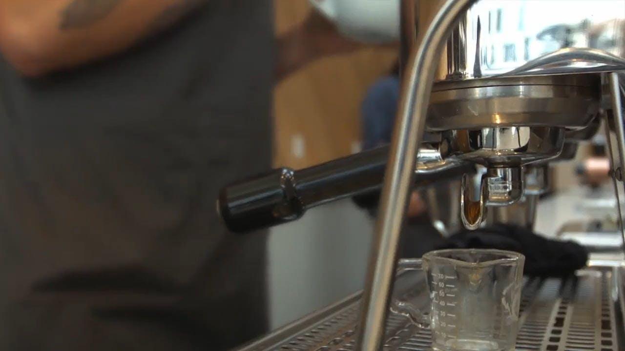 Explore Vibrant Urban Lifestyle With Coffee Brewing And Casual Interactions.